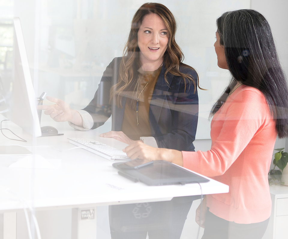 Two female colleagues at a desk